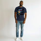 Hustler Design navy blue 100% cotton t-shirt with a cyberpunk graphic of a car crashing through glass with neon text "NO EXIT? MAKE ONE".
