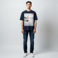 Hustler Design navy blue unisex t-shirt with a serene graphic of a person in a boat on a misty lake at sunrise, with the text "Let go."