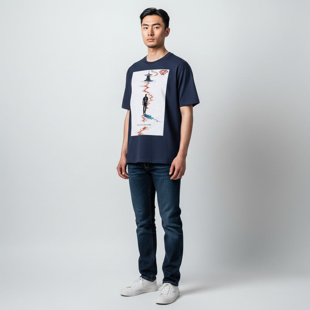 Hustler Design navy blue unisex t-shirt with a graphic print of a man walking on a red path towards a pagoda, text reads "Follow your own path."