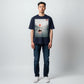 Hustler Design navy blue unisex t-shirt with a serene lake scene graphic, featuring a person in a boat under a red sun.