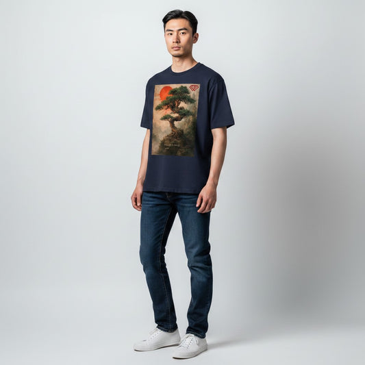 Hustler Design navy blue unisex t-shirt with a minimalist Zen aesthetic graphic of a bonsai tree and a red sun. Text reads "Rooted in being."